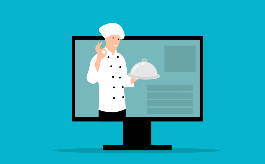 Chef raffigurato all'interno un monitor di un computer per simboleggiare i siti web per ristoranti.